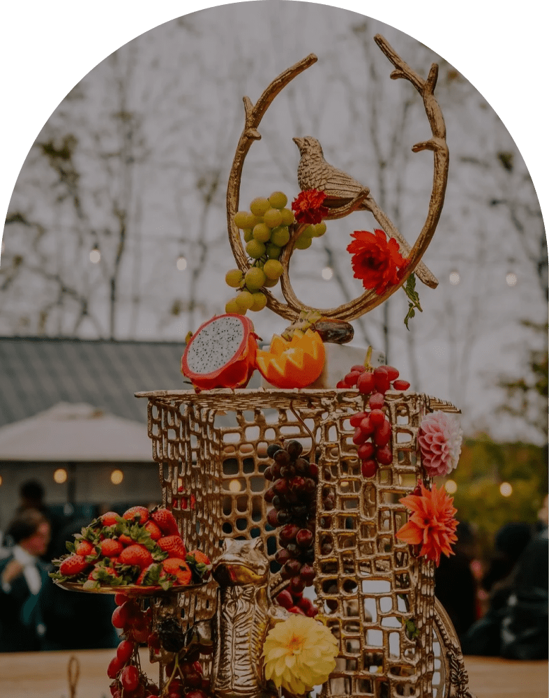 Artistic fruit sculpture with bird ornament