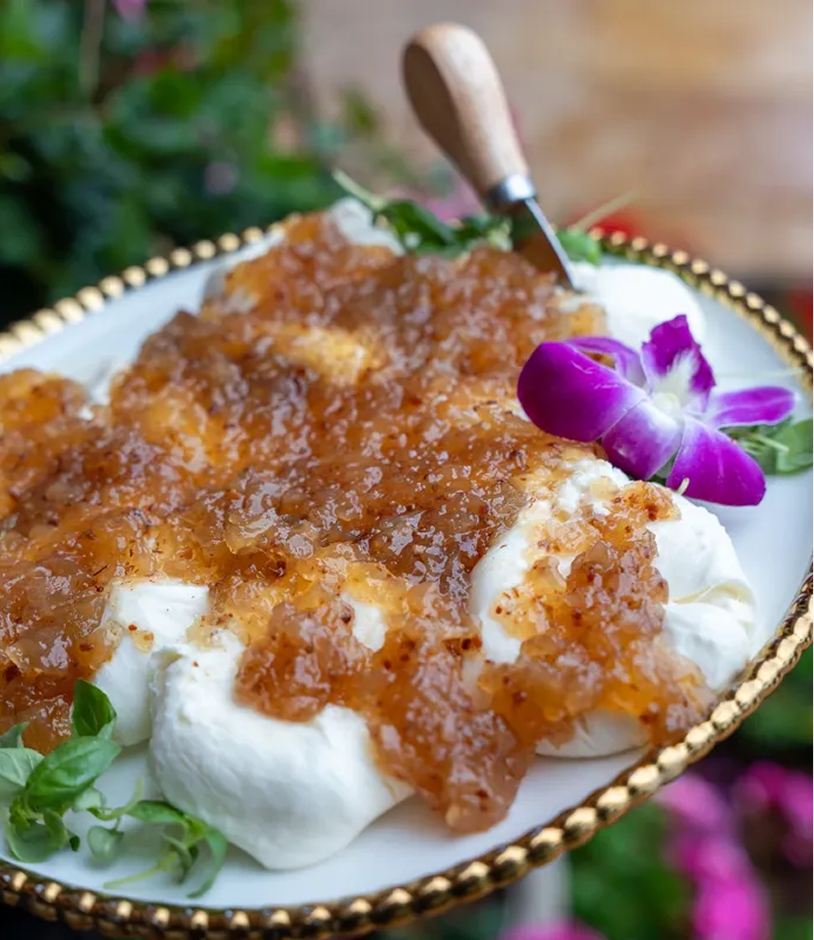 Elegant dessert plate with caramel and flower