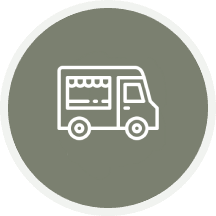 Icon of a food truck on a green circular background.